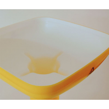 Top of Speidel mill hopper with white and yellow plastic.