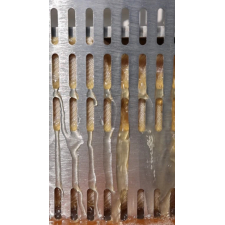 Apple juice running down the Vares cage during pressing.